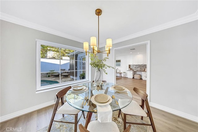 3024 Via Rivera, Palos Verdes Estates, CA 90274 - dining room featuring a chandelier, wood finished floors, and crown molding