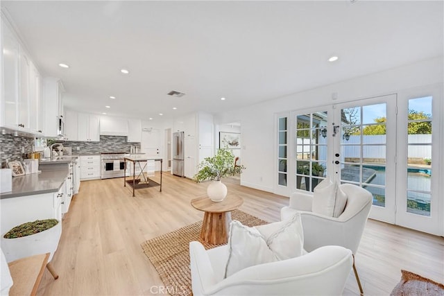 3024 Via Rivera, Palos Verdes Estates, CA 90274 - living room featuring french doors, light wood-style floors, and recessed lighting