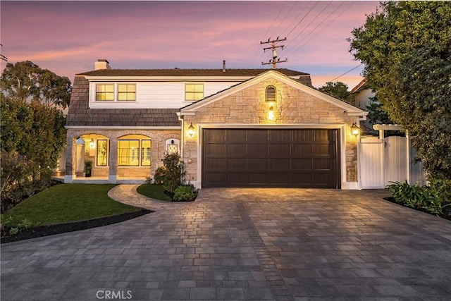 3024 Via Rivera, Palos Verdes Estates, CA 90274 - view of front of house with a chimney, a garage, decorative driveway, and stone siding