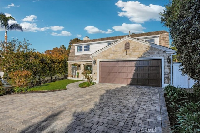 3024 Via Rivera, Palos Verdes Estates, CA 90274 - view of front of property with stone siding, a garage, decorative driveway, and a chimney