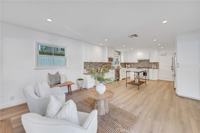 3024 Via Rivera, Palos Verdes Estates, CA 90274 - living room featuring light wood-style flooring and recessed lighting