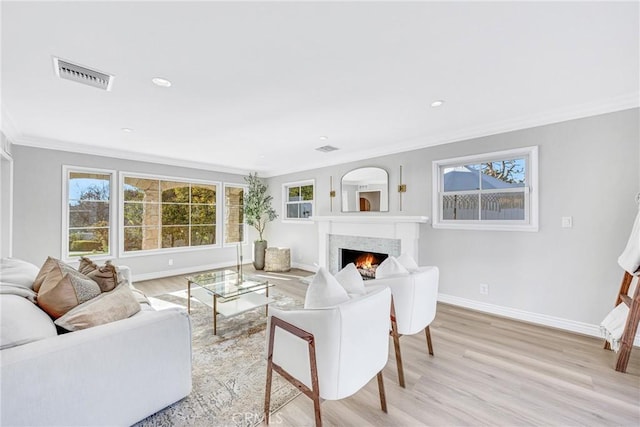 3024 Via Rivera, Palos Verdes Estates, CA 90274 - living area featuring crown molding, a warm lit fireplace, light wood finished floors, and recessed lighting