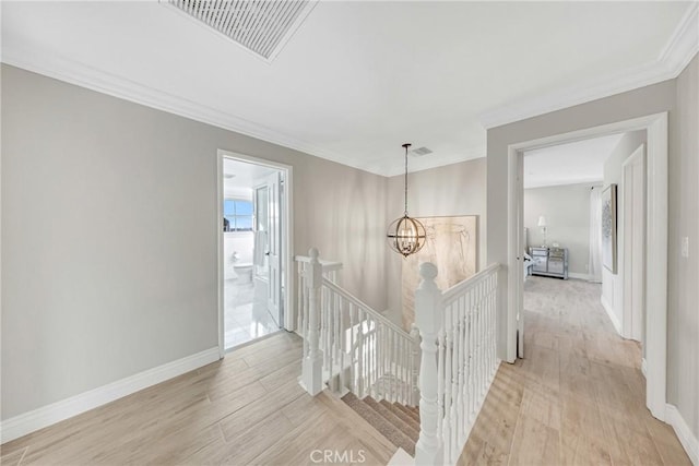 3024 Via Rivera, Palos Verdes Estates, CA 90274 - corridor with an upstairs landing, light wood-style flooring, ornamental molding, and a chandelier