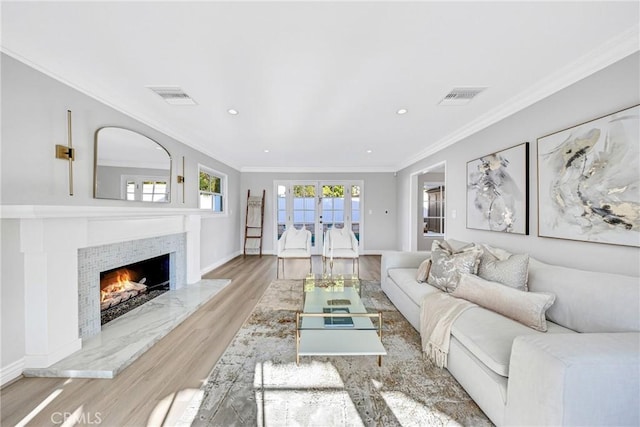 3024 Via Rivera, Palos Verdes Estates, CA 90274 - living area with wood finished floors, a tile fireplace, ornamental molding, french doors, and recessed lighting