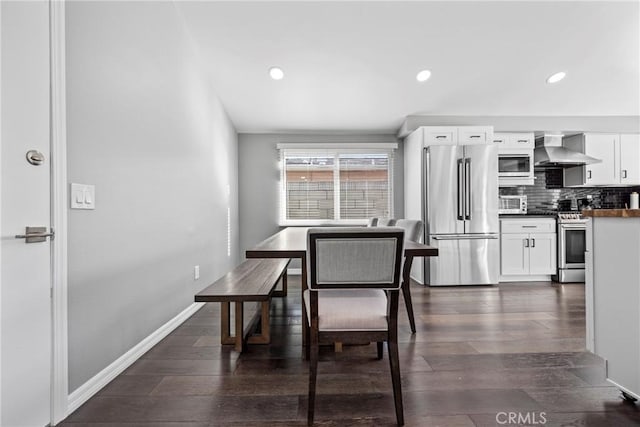 dining space with a toaster, dark wood-style flooring, recessed lighting, and baseboards