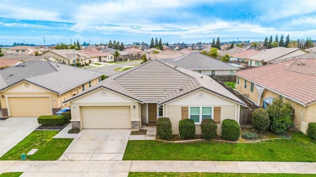 4907 Durant Way, Merced, CA 95348 - ranch-style house featuring a residential view, a garage, a front lawn, concrete driveway, and stucco siding