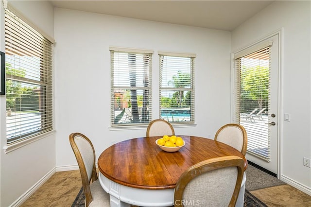 dining space featuring baseboards