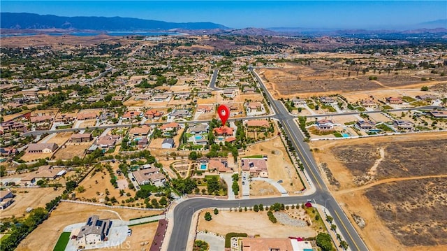 drone / aerial view featuring a mountain view