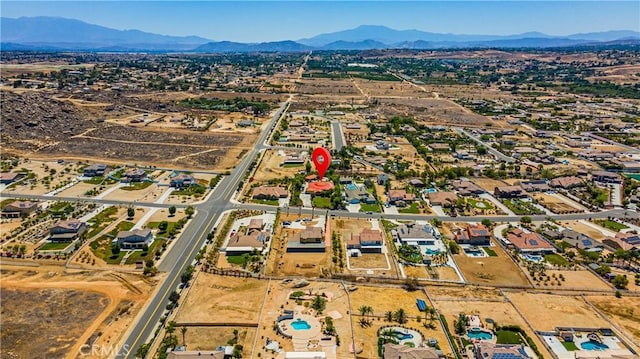 drone / aerial view featuring a mountain view