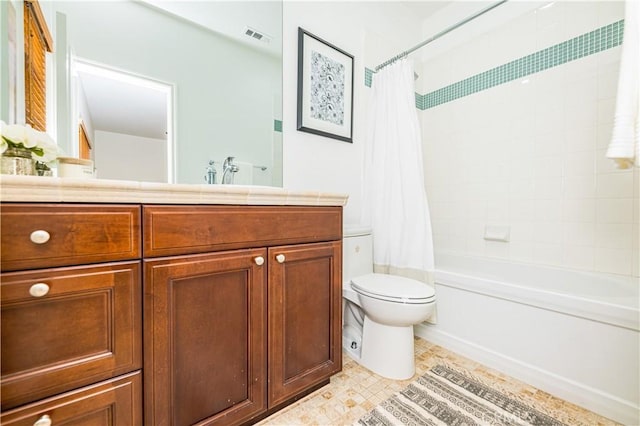 bathroom featuring visible vents, vanity, toilet, and shower / bath combo with shower curtain