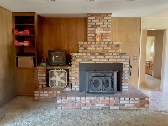 interior details with a wood stove and carpet