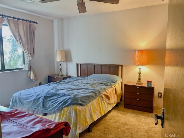 bedroom featuring ceiling fan and carpet flooring