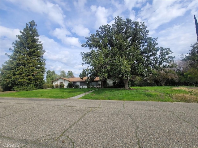 view of front of home with an attached garage and a front yard