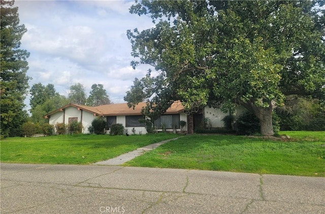 view of front of house with a front lawn