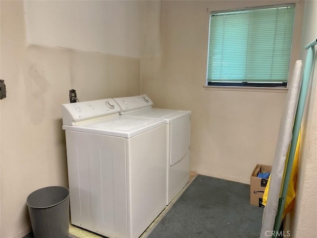 laundry area featuring laundry area, separate washer and dryer, and carpet flooring