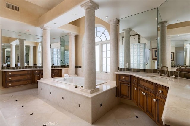 3824 Vista Blanca, San Clemente, CA 92672 - bathroom featuring ornate columns, a garden tub, tile patterned flooring, and two vanities