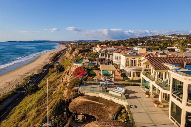 aerial view featuring a water view and a view of the beach