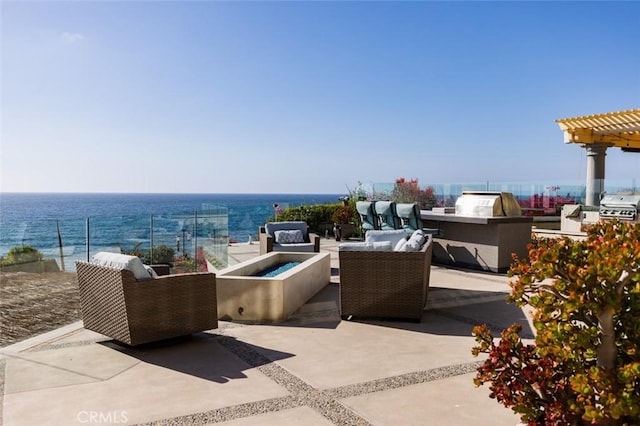 3824 Vista Blanca, San Clemente, CA 92672 - view of patio / terrace with area for grilling, an outdoor living space with a fire pit, a grill, a water view, and a pergola