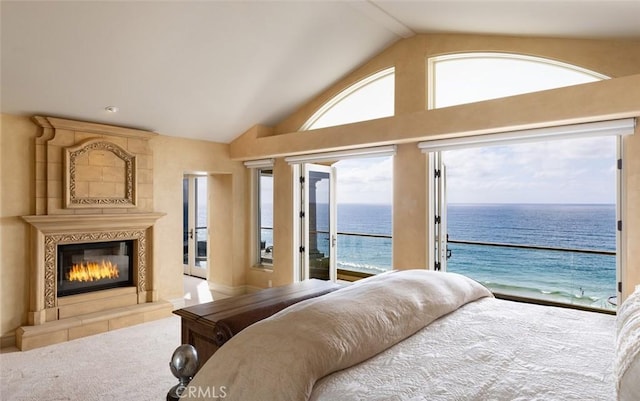 3824 Vista Blanca, San Clemente, CA 92672 - bedroom featuring access to outside, a water view, lofted ceiling, multiple windows, and a tile fireplace