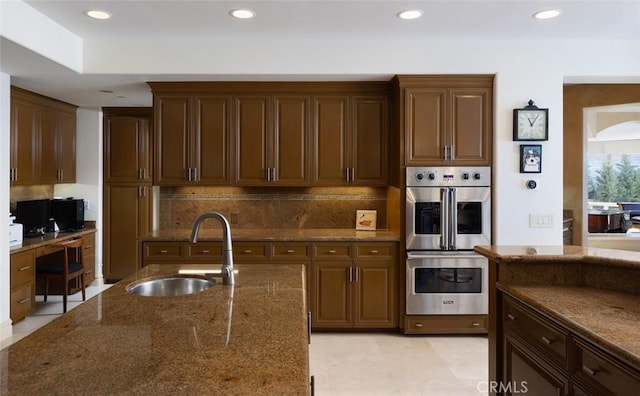 3824 Vista Blanca, San Clemente, CA 92672 - kitchen with a sink, double oven, backsplash, dark stone counters, and recessed lighting