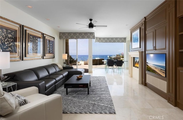 3824 Vista Blanca, San Clemente, CA 92672 - living room featuring a ceiling fan, a glass covered fireplace, and light marble finish flooring