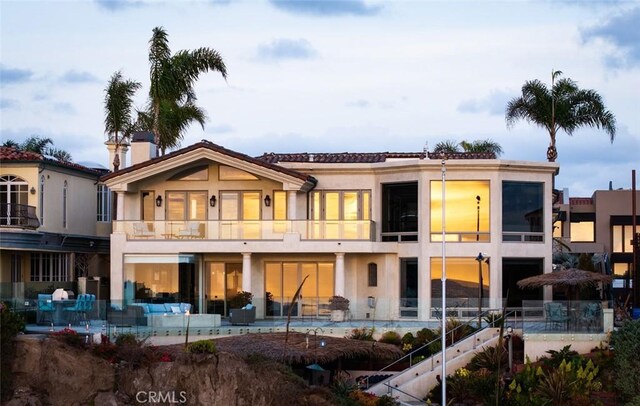 3824 Vista Blanca, San Clemente, CA 92672 - rear view of house featuring a balcony, a patio, stucco siding, and an outdoor living space