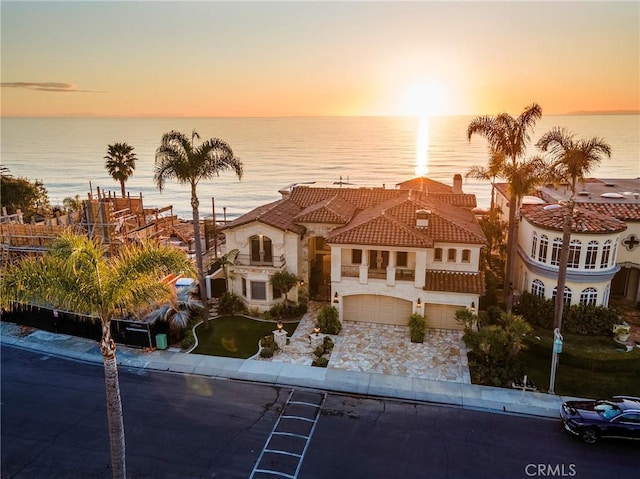 3824 Vista Blanca, San Clemente, CA 92672 - mediterranean / spanish home featuring an attached garage, a water view, a tile roof, driveway, and stucco siding