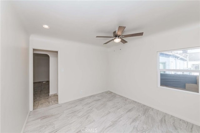 unfurnished room with baseboards, a ceiling fan, and recessed lighting