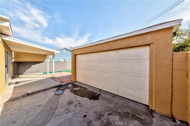 garage featuring fence