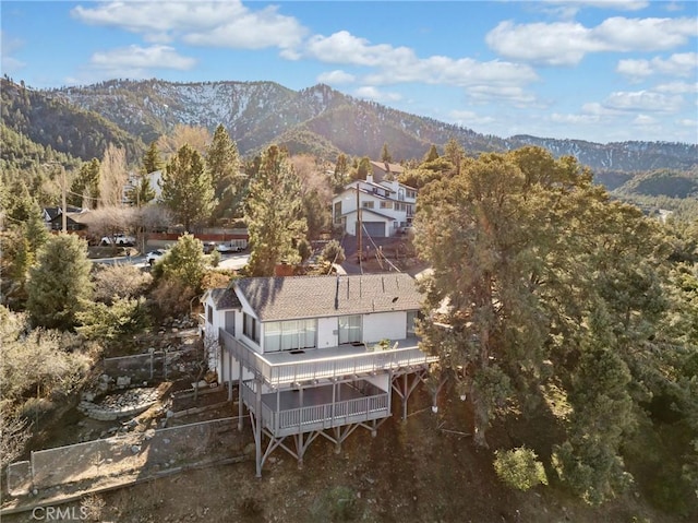 birds eye view of property with a mountain view