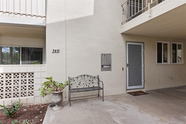 entrance to property with a patio