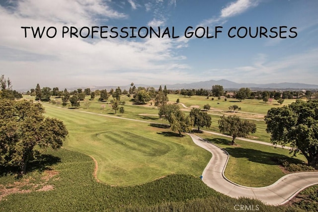 bird's eye view featuring view of golf course and a mountain view