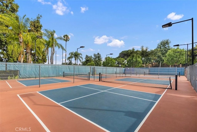 view of sport court with fence