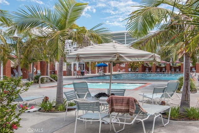 community pool with a patio area