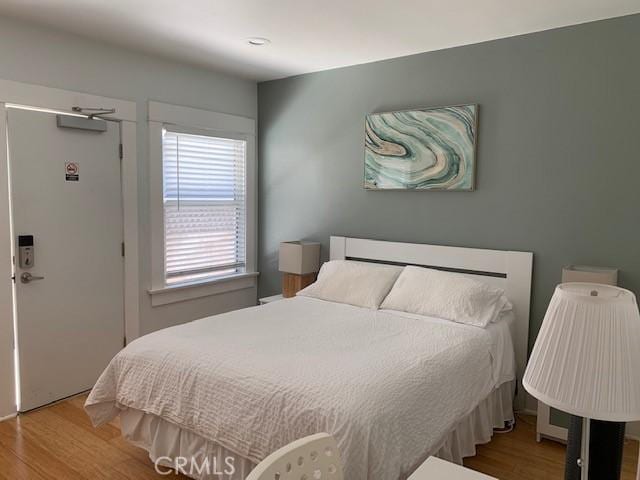 bedroom with wood finished floors