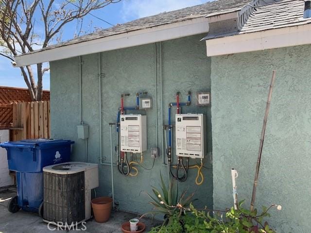 exterior space featuring fence and stucco siding