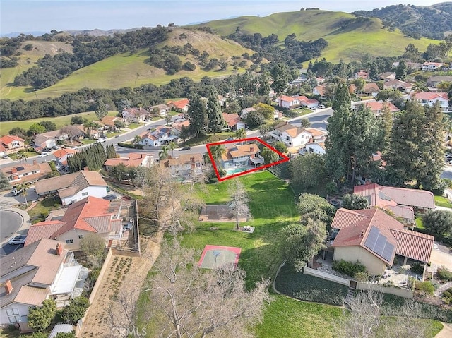 drone / aerial view featuring a mountain view and a residential view