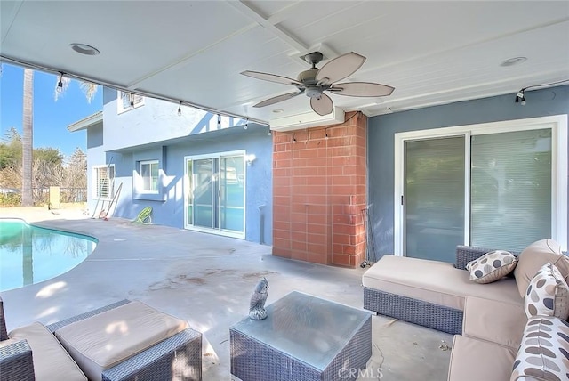 exterior space with outdoor lounge area, a patio area, and a ceiling fan