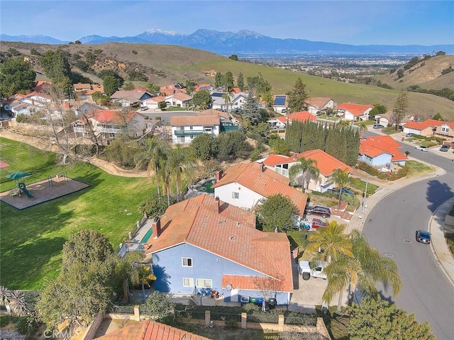 birds eye view of property featuring a mountain view and a residential view