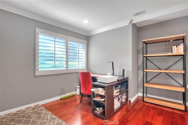 office with crown molding, visible vents, baseboards, and wood finished floors