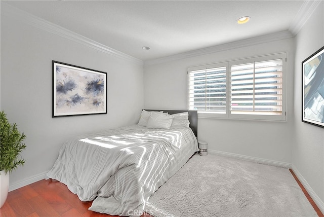 bedroom with baseboards and crown molding