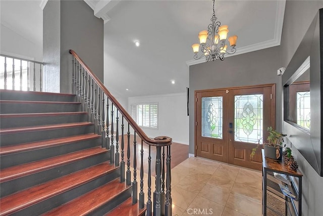 entrance foyer featuring light tile patterned flooring, a notable chandelier, french doors, stairway, and crown molding