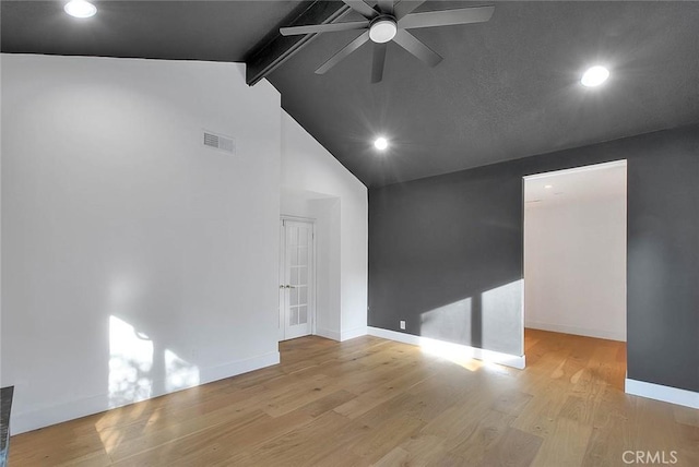 empty room featuring visible vents, a ceiling fan, wood finished floors, beamed ceiling, and baseboards