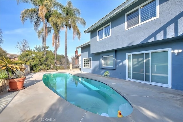 outdoor pool featuring a patio