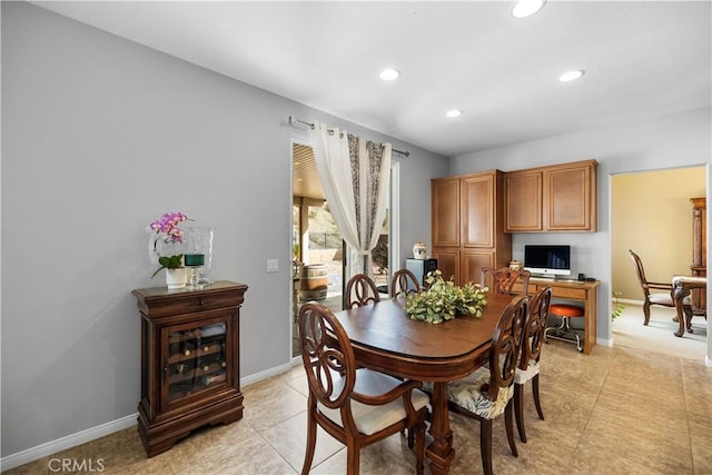 dining area featuring light tile patterned floors, baseboards, and recessed lighting