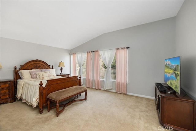 bedroom featuring light carpet, lofted ceiling, and baseboards