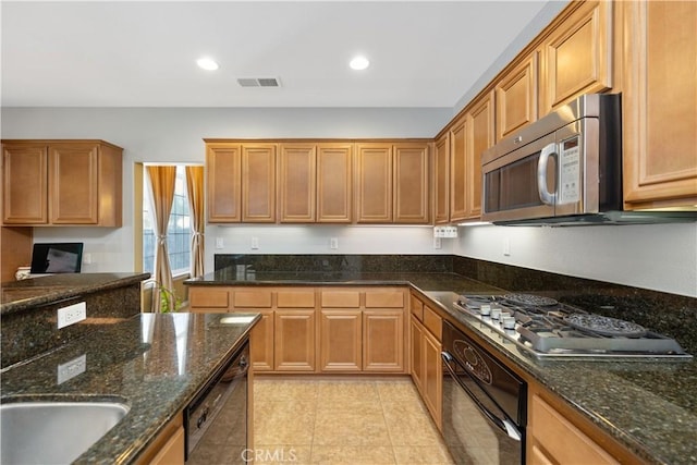 kitchen with light tile patterned floors, recessed lighting, visible vents, dark stone counters, and black appliances