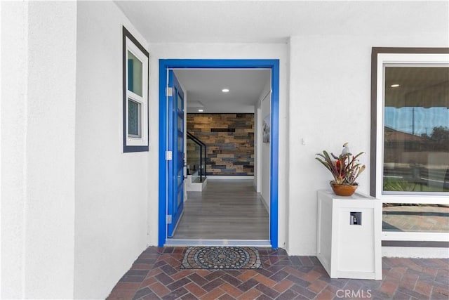 entrance to property with stucco siding