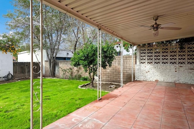 view of patio / terrace featuring a fenced backyard and a ceiling fan