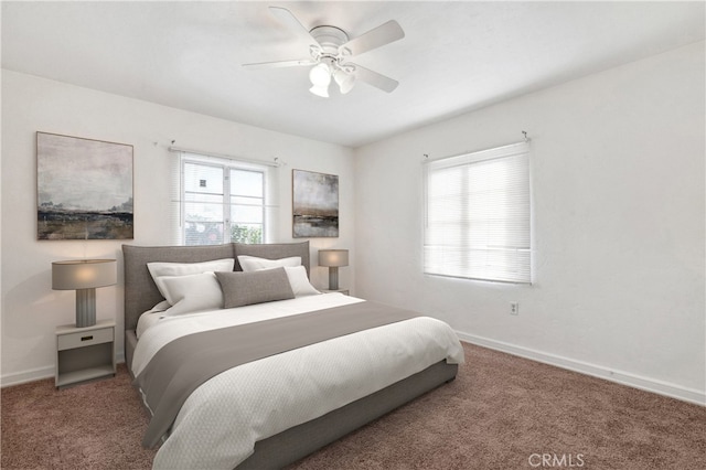 bedroom featuring ceiling fan, baseboards, and carpet